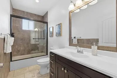 a bathroom with a sink and a toilet and a shower at Spacious 3BR Home with Pool in La Mesa