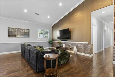 a living room with a couch and a tv at Spacious 3BR Home with Pool in La Mesa