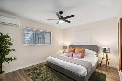 a bedroom with a bed with a ceiling fan at Pacific Beach Paradise-Walk to Beach &Bay in San Diego