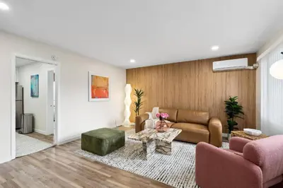 a living room with a couch and a table at Pacific Beach Paradise-Walk to Beach &Bay in San Diego