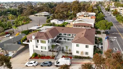 an aerial view of a white house with a brown roof at Cozy Studio Near Balboa Park in San Diego