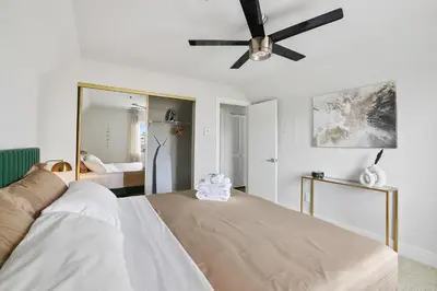 a bedroom with a bed and a ceiling fan at Modern 1BD in La Jolla Mountain City Views Free Parking in San Diego