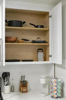 a kitchen cabinet filled with pots and pans at Modern 1BD in La Jolla Mountain City Views Free Parking in San Diego