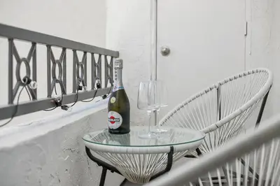 a bottle of champagne sitting on a table with a wine glass at Modern 1BD in La Jolla Mountain City Views Free Parking in San Diego