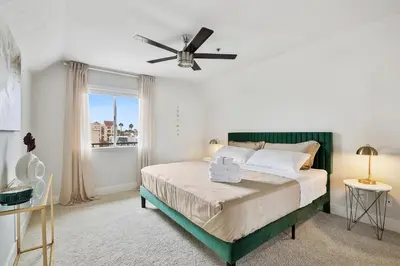 a bedroom with a bed with a ceiling fan at Modern 1BD in La Jolla Mountain City Views Free Parking in San Diego