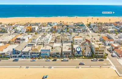 an aerial view of a city with the beach at Bayfront 4Br Retreat With Stunning Newport Harbor Views By Beachview Rentals in Newport Beach