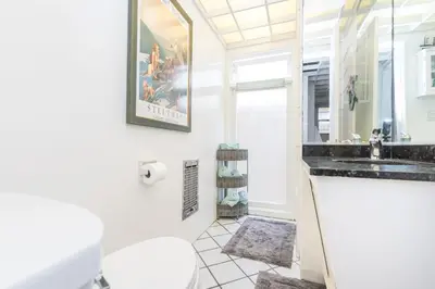 a bathroom with a sink and a toilet at Bayfront 4Br Retreat With Stunning Newport Harbor Views By Beachview Rentals in Newport Beach