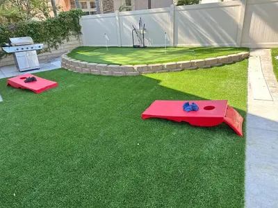 two red mats on the grass in a backyard at Oceanside Tropical Resort with HEATED POOL & SPA! in Oceanside