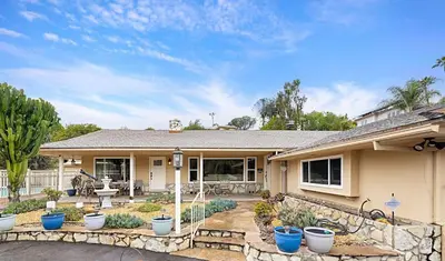 a house with a yard with blue potted plants at Serene 4BR La Mesa Hideaway in La Mesa
