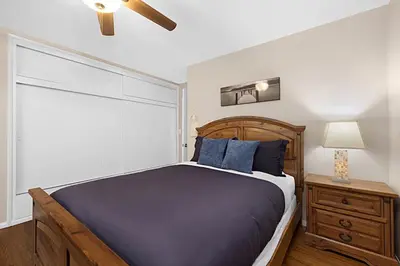 a bedroom with a bed with a wooden head board at Serene 4BR La Mesa Hideaway in La Mesa