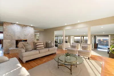 a living room with a couch and chairs and a fireplace at Stunning View Estate with Pool & Game Room in La Mesa
