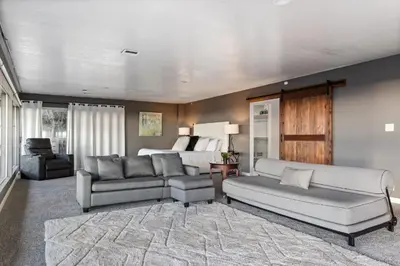 a living room with a couch and a bed at Stunning View Estate with Pool & Game Room in La Mesa