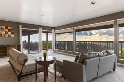 a living room with a couch and a table at Stunning View Estate with Pool & Game Room in La Mesa