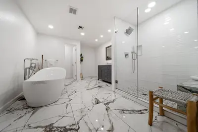 a white bathroom with a tub and a shower at Stunning View Estate with Pool & Game Room in La Mesa