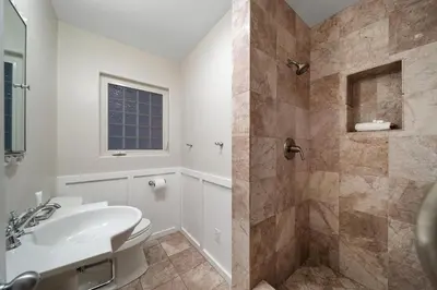 a white bathroom with a sink and a shower at Stunning View Estate with Pool & Game Room in La Mesa