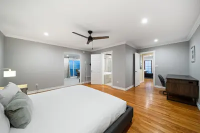 a bedroom with a bed and a ceiling fan at Stunning View Estate with Pool & Game Room in La Mesa