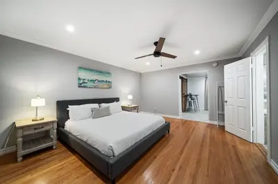 a bedroom with a bed and a ceiling fan at Stunning View Estate with Pool & Game Room in La Mesa
