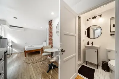 a bathroom with a toilet and a sink at Little Italy Delight 3 bedroom backyard parking in San Diego