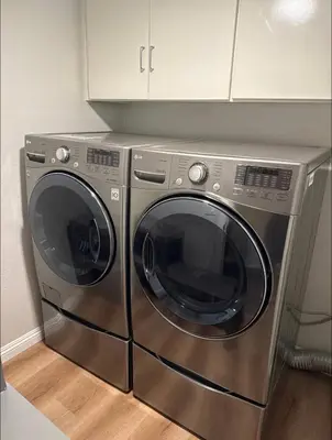 a stainless steel washer and dryer in a kitchen at \u53cc\u4eba\u95f4 in Irvine