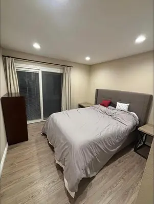 a bedroom with a large bed and a window at \u53cc\u4eba\u95f4 in Irvine