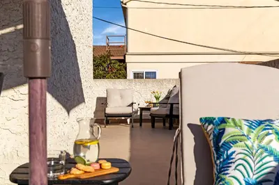 a glass vase on a table on a patio at Cozy Coastal Townhome in the Heart of Pacific Beach in San Diego
