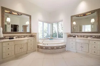 a large bathroom with a tub and two mirrors at ResortHome Pickle Ball Pool MovieRoom Gym Sauna Villa in Del Mar