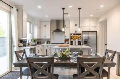 a kitchen with a table and chairs in a kitchen at Marbella Lane - Elegant 5BR Home Rancho Mission in Ladera Ranch