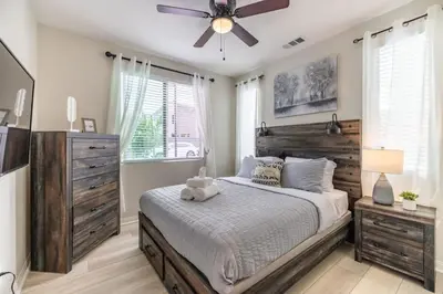 a bedroom with a bed and a ceiling fan at Marbella Lane - Elegant 5BR Home Rancho Mission in Ladera Ranch