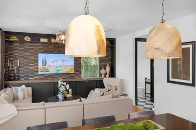 a living room with two large pendant lights at Marbella Lane - Stylish Dream Home in RMV w Pool in Mission Viejo