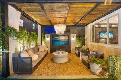 a living room with a couch and a tv at Marbella Lane - Stylish Dream Home in RMV w Pool in Mission Viejo