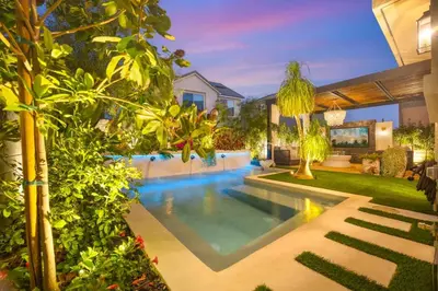 a swimming pool in the backyard of a house at Marbella Lane - Stylish Dream Home in RMV w Pool in Mission Viejo