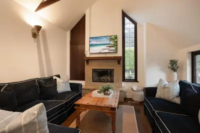 a living room with two couches and a table at Walk to La Jolla Shores 2 homes Luxury Villa in San Diego