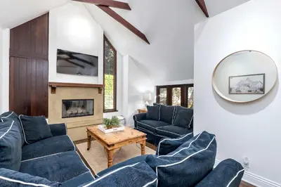 a living room with blue furniture and a mirror at Walk to La Jolla Shores 2 homes Luxury Villa in San Diego