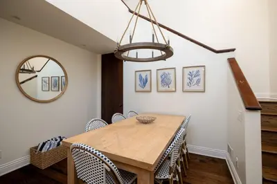 a dining room with a wooden table and chairs at Walk to La Jolla Shores 2 homes Luxury Villa in San Diego