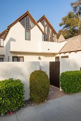 a white house with a fence and a hedge at Walk to La Jolla Shores 2 homes Luxury Villa in San Diego