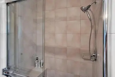 a shower with a glass door in a bathroom at Fallbrook Pool & Spa Wine Country Estate in Fallbrook