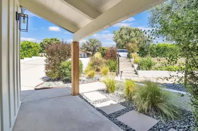 a front porch of a house with plants at Fallbrook Pool & Spa Wine Country Estate in Fallbrook
