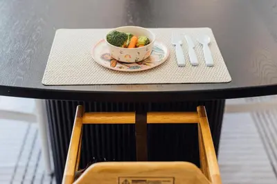 a table with a bowl of broccoli and a plate of vegetables at Palm Grove Luxe King, Wet Room & Chefs Kitchen in Carlsbad