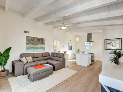 a living room with a couch and a table at Seaglass 222 in San Clemente