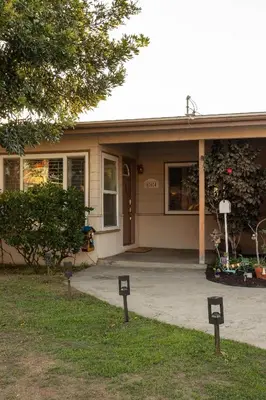 a house with three signs in the front yard at Pool Oasis Central Villa in El Cajon