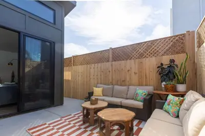 a patio with a couch and a table at Newly Remodeled OB Beach house walk to all Parking in San Diego