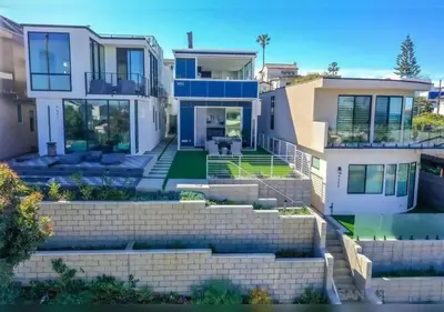 a large house with a staircase in front of it at Luxurious Beach Master Suite in San Diego