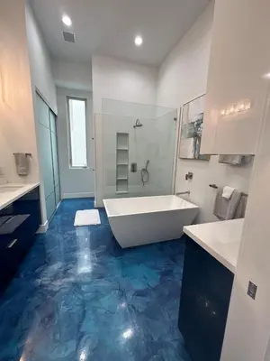 a bathroom with a white tub and a blue floor at Luxurious Beach Master Suite in San Diego