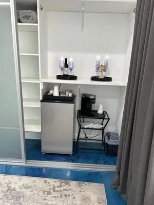 a room with a shelf with glasses on it at Luxurious Beach Master Suite in San Diego