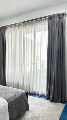 a bedroom with a bed and a large window at Luxurious Beach Master Suite in San Diego