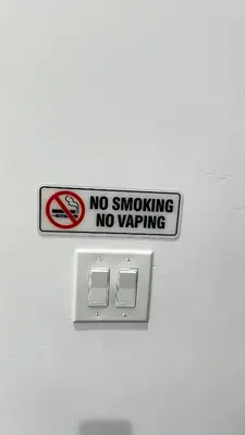 a no smoking no warning sign on a wall at Luxurious Beach Master Suite in San Diego