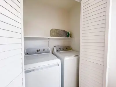 a white laundry room with a washer and dryer at Harbor View Haven by Balboa Park in San Diego