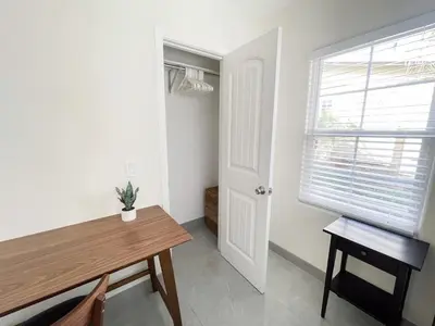 a room with a wooden table and a window at Central Charm in Hillcrest near Scripps Mercy in San Diego