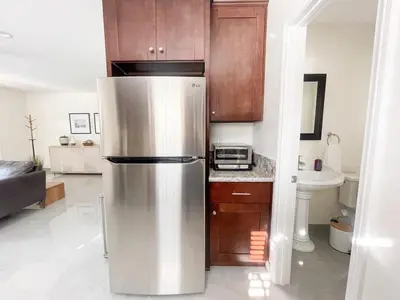 a kitchen with a stainless steel refrigerator in a room at Central Charm in Hillcrest near Scripps Mercy in San Diego