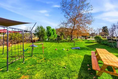 a park with a picnic table and a playground at Indoor Pool & Spa - Gym - Sauna - Pickleball Court in Perris